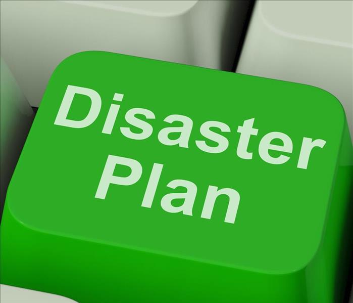 A green computer key that says Disaster plan