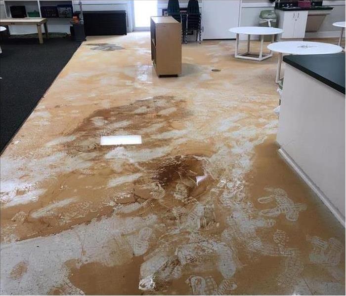 Floor with mud, dirty water enter a building