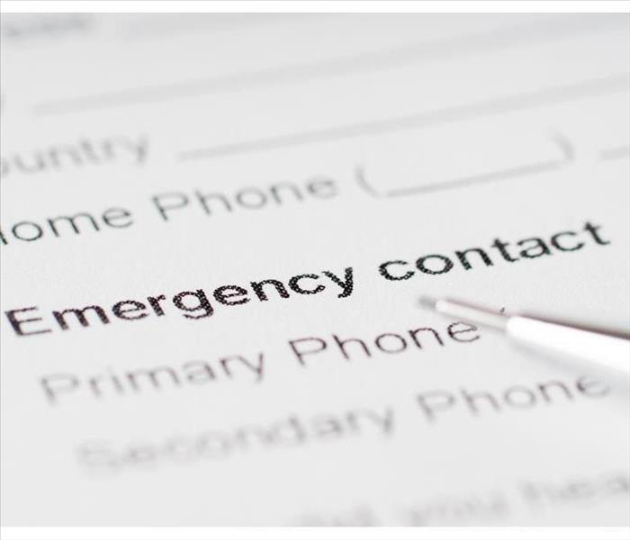 emergency contact paper sheet with phone number