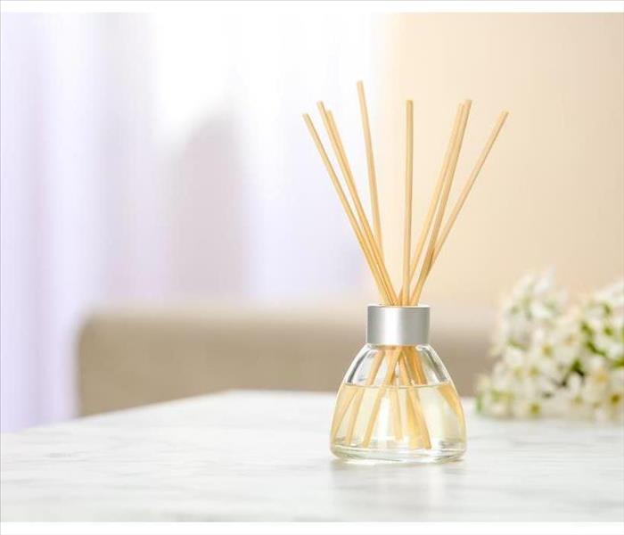 Aromatic reed freshener on table in room