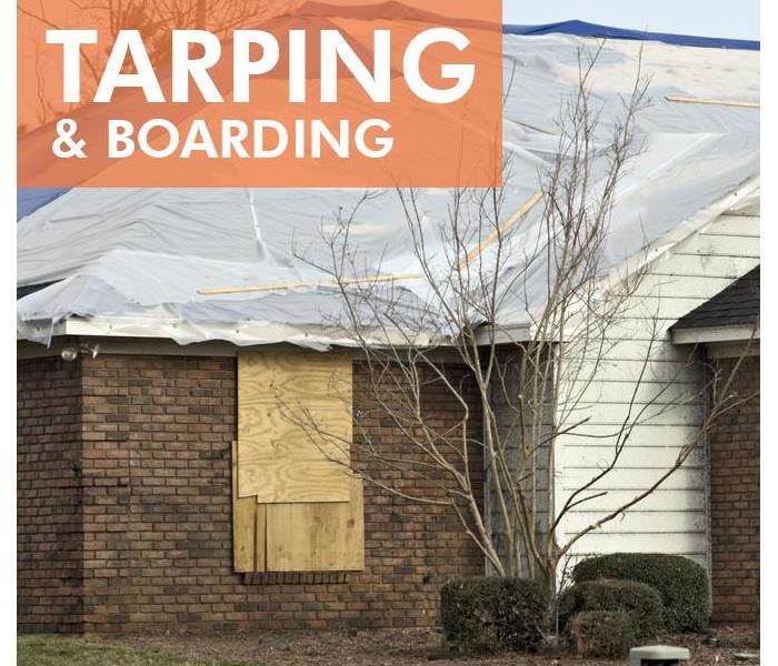Tarped and boarded home